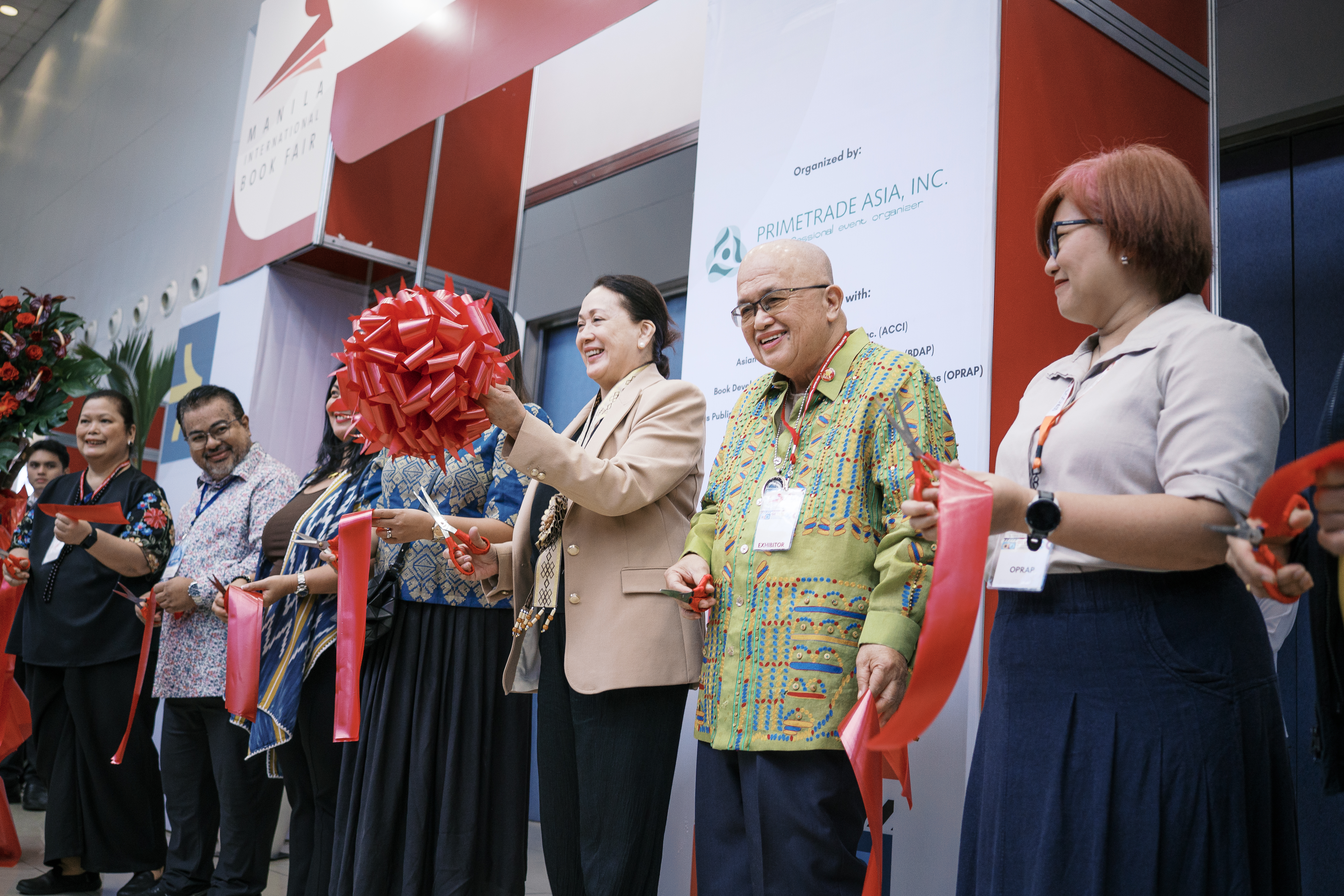 Book fair visitors exploring exhibits